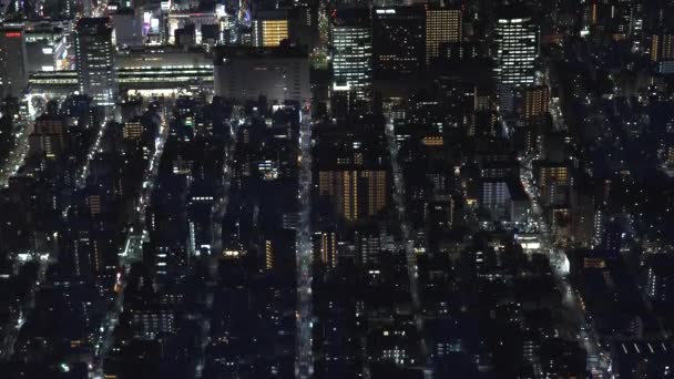 De verlichte lichten van de stad landschap op de avond in Tokio Japan — Stockvideo