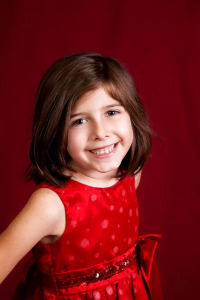 Ritratto di bambina su rosso — Foto Stock
