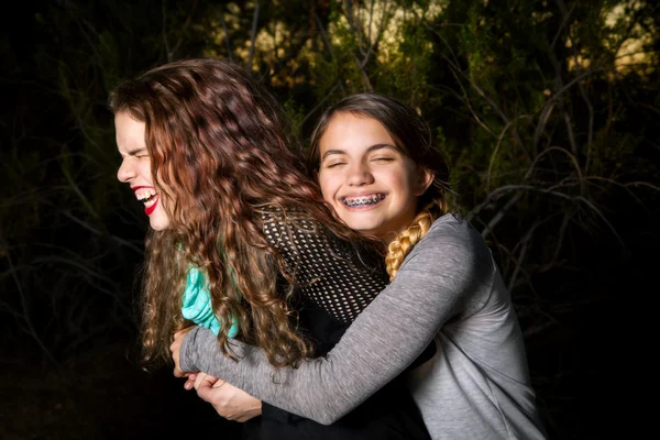 Teenage Sisters Being Silly and Hugging — Stock Photo, Image