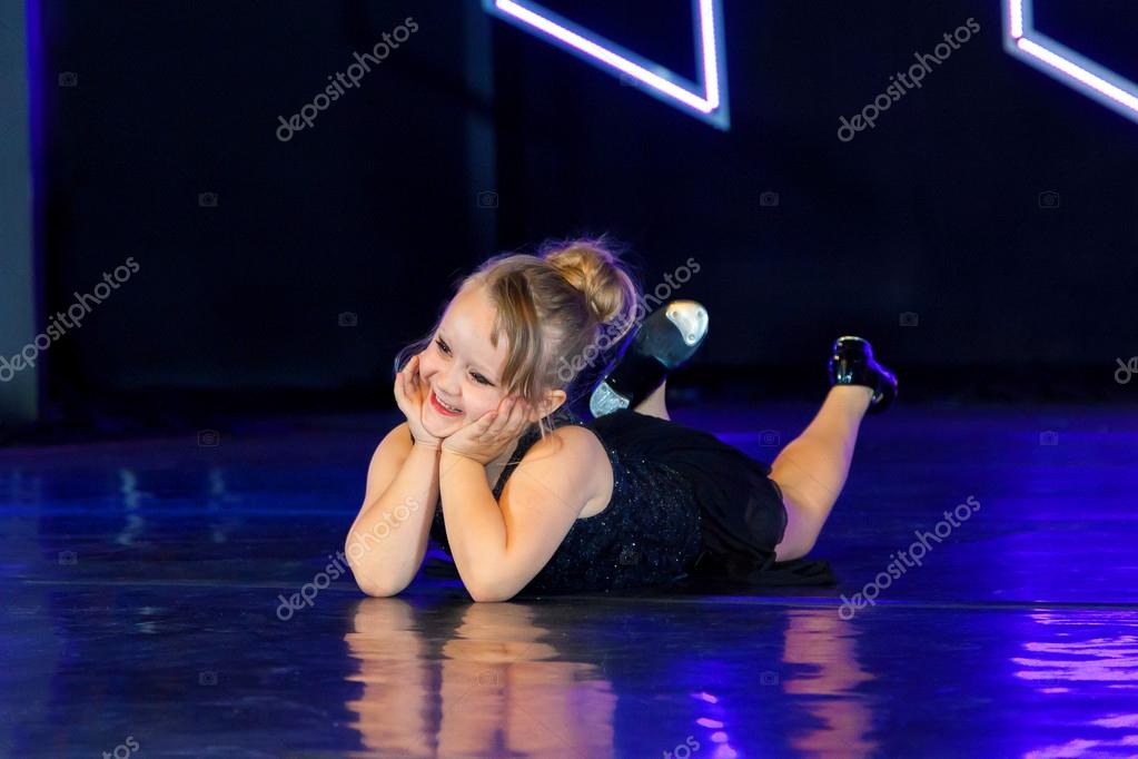Adorable Tap Dancer Laying On Belly On Stage ⬇ Stock Photo, Image by