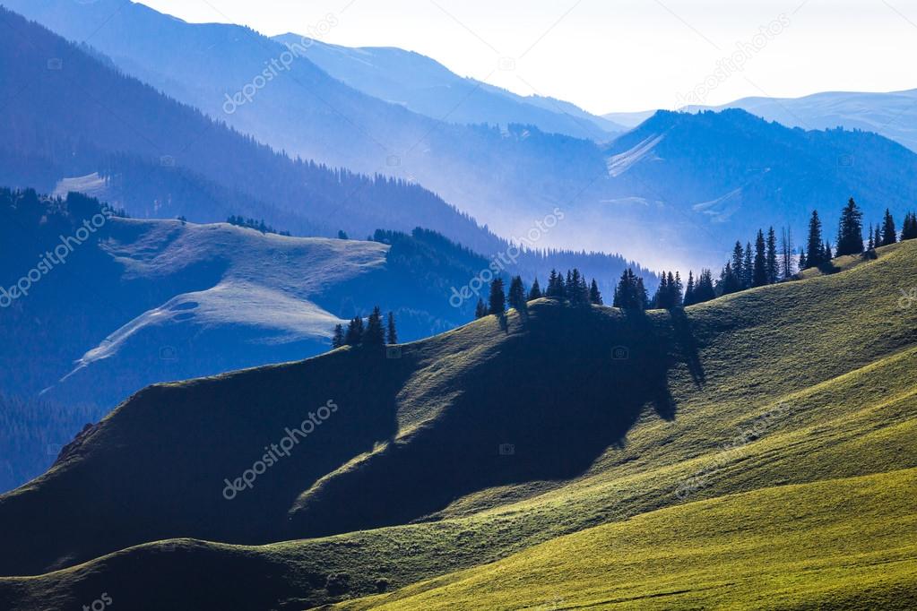 The sunset layers of mountains, vast background material.