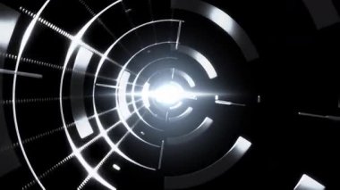 Canlı eşmerkezli daireler, şekiller ve parlayan merkezi bir ışık tüneli.