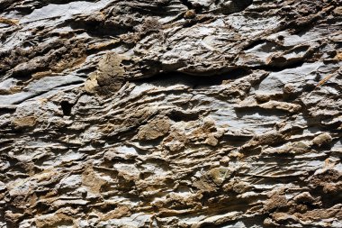 Yıkılmış taş duvarın soyut bir parçası, yüzeysel alan derinliğine dikkat edin.