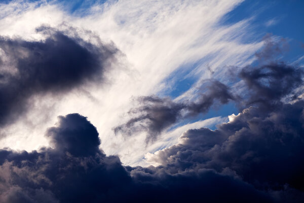 Beautiful black and white clouds with sunbeams coming through