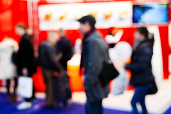 Blur image of group of people passing at job expo; blurred 100%