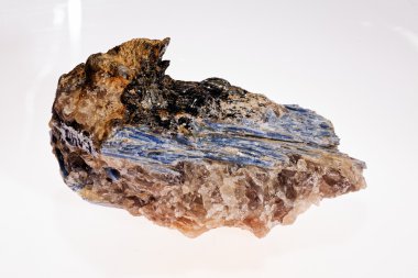  kyanite mineral with garnets on the white background