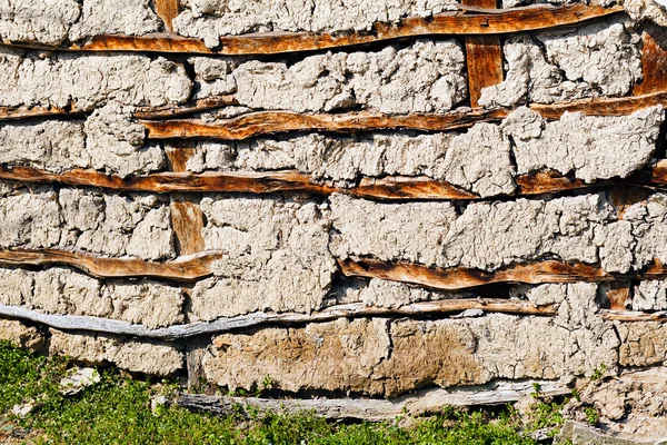 handmade wall of boards and concrete