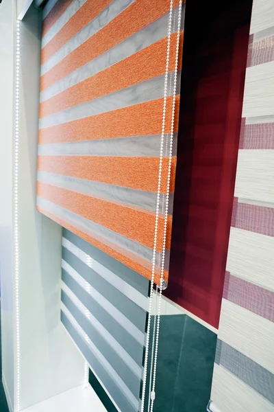Samples of blinds and curtains for the windows with mehanism