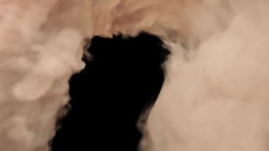 3D pink smoke swirling on a black background