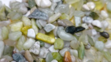 Doğal yeşil çakıl taşları dokusu organik mineral renkleri ve pürüzsüz küçük kayalar tasarlamak için mükemmel bir soyut doğa kalıbı yaratıyor.