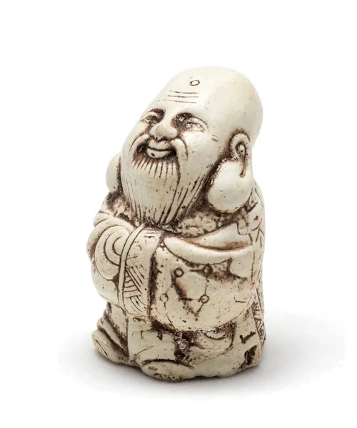 Netsuke voor een tevreden man in een badjas. Geïsoleerd — Stockfoto