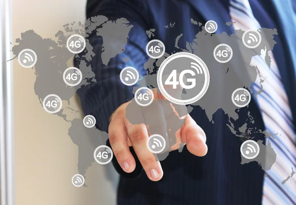 The businessman clicks on the icon to connect to wireless 4G, on the touch screen with the world map . The concept of connecting to the Internet using 4G . — Stock Photo, Image