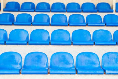 Empty blue seats of sport stadium. Sports events, competitions, championships, without spectators during quarantine.
