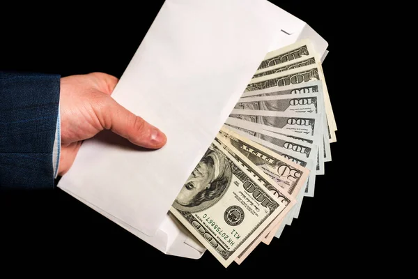 Hand And Money In Envelope On Black Background The Envelope With Cash In Hands Closeup Of Businessman S Hand Holding An Envelope Full Of Money Bribe Paying Stock Photo