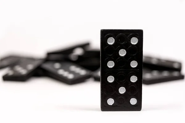 One Black Wooden Domino Chain Standing Fallen Dominoes White Background — Stock Photo, Image