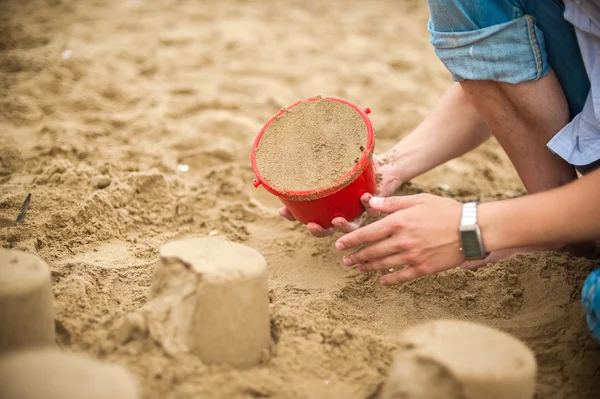 Hand making a sand mold using molds — Stock Photo, Image