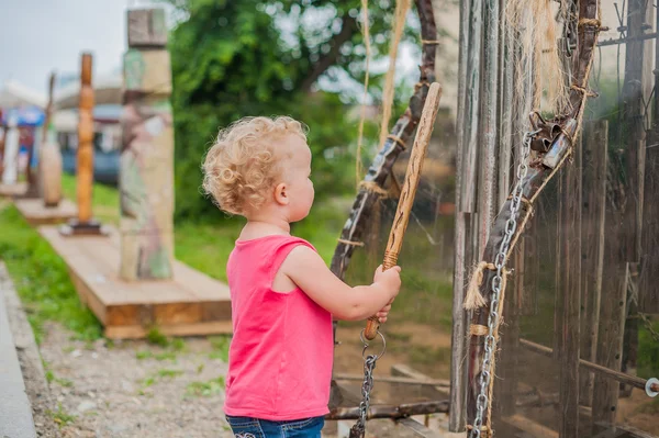 The girl rings the bell — Stock Photo, Image