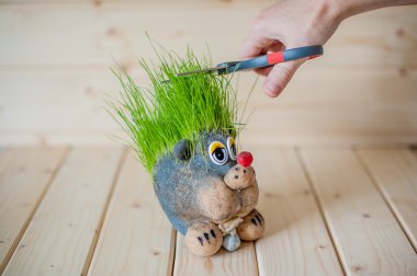 Hair cutting, hedgehog with needles of grass clipart