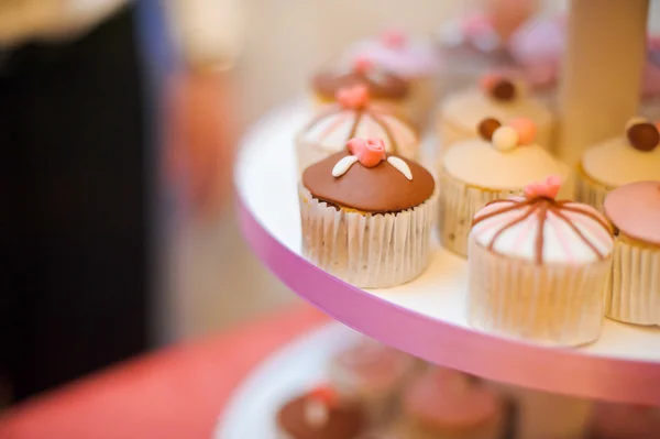 mini cupcakes on a multi level tier