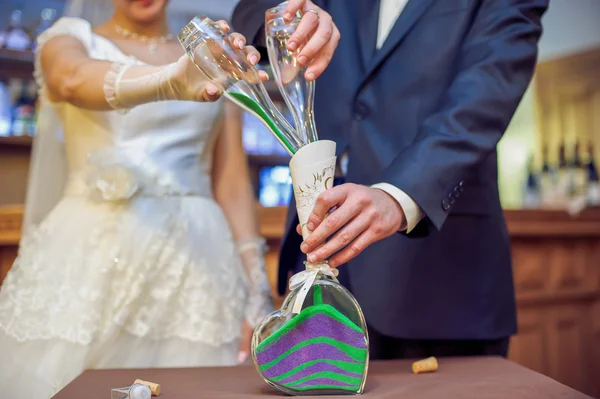 Hands pouring sand during sand ceremony — Stock Photo, Image