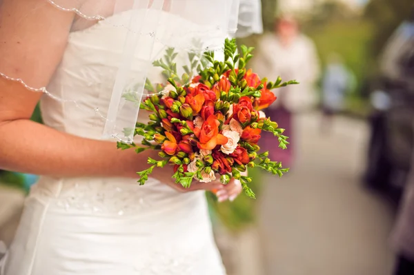 Bouquet in the hands of the bride Royalty Free Stock Images