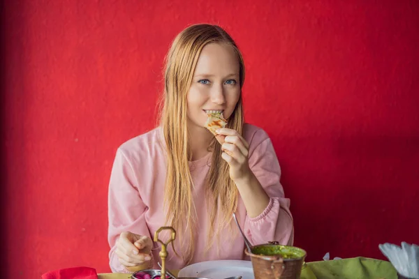 Caucasian Woman Eating Indian Food in Cafe. Traditional Indian dish. Indian food. Close-up — Stock Photo, Image