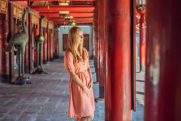 stock image Woman tourist in Temple of Literature in Hanoi in Southeast Asia, Vietnam. Temple of Confucius in Vietnamese capital. Vietnam reopens after coronavirus quarantine COVID 19