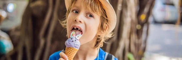 Cute child eating rabbit ice cream outdoors BANNER, LONG FORMAT — Stock Photo, Image