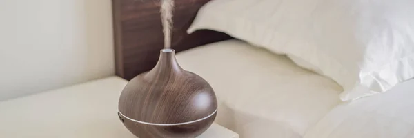 BANNER, LONG FORMAT Aromatherapy Concept. Wooden Electric Ultrasonic Essential Oil Aroma Diffuser and Humidifier. Ultrasonic aroma diffuser for home — Stock Photo, Image