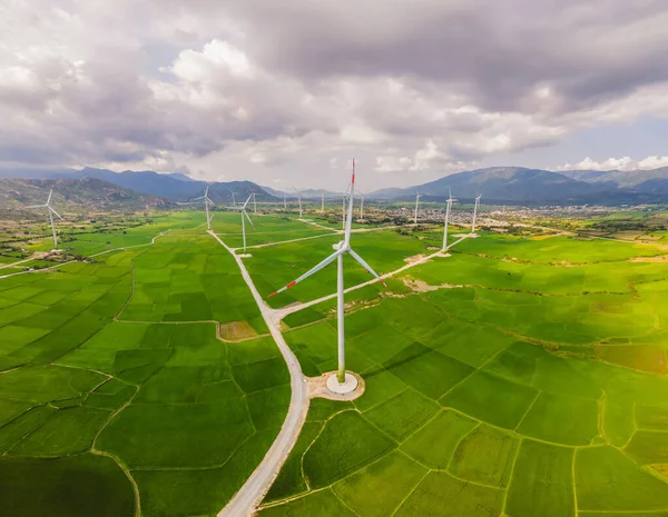 Wind power plant. green meadow with Wind turbines generating electricity