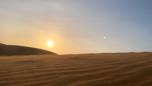 Timelapse shot. Sunset in a red sand dunes desert — Stock Video