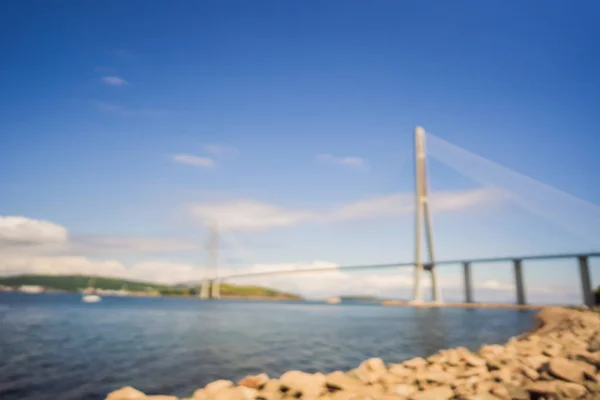 Blurred image. Cable-stayed bridge to Russian Island. Vladivostok. Russia. Vladivostok is the largest port on Russias Pacific coast and the center of APEC Forum — Stock Photo, Image