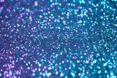 Mavi arka plan. Pırıl pırıl arka plan. Soyut Tatil arkaplanı. Bokeh geçmişi. Tatil geçmişleri. Kopyalama alanı olan soyut arkaplan. Mavi renkli ışıltılar