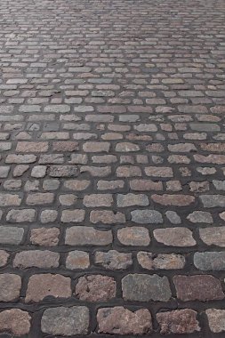 Close-up of setts pavement, which are quarried stones that are cut into a roughly rectangular or square shape, Pitksilta, Helsinki, Finland.