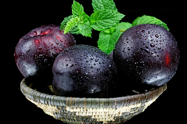 Pluots in a basket.