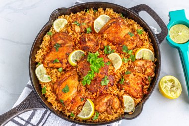 Spanish Chicken and Rice in a Skillet Directly Above Horizontal Photo