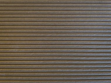 Üst üste dizilmiş karton arka plan dokuyu ve deseni gösteriyor. Paketleme, malzeme ve tasarım temaları için ideal.