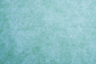 Mavi ve yeşil tonlarda soyut kağıt dokusu. Tasarım, sanat ve yaratıcı temalar için mükemmel.