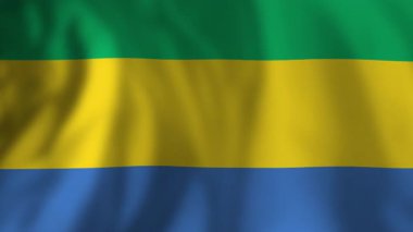 Gabon ulusal bayrağı hafifçe sallanıyor, yumuşak esintiye karşı milli gurur ve kimliği simgeliyor.