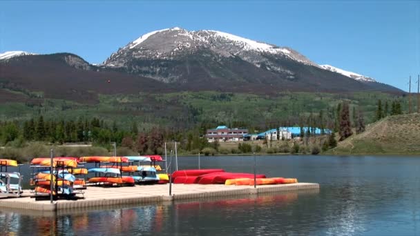 Dillon Lake with Canoes on Pier — Stock Video
