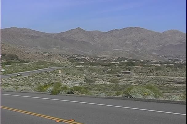 Asphalt road in desert — Stockvideo