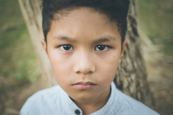 A scared young Asian boy — Stock Photo, Image