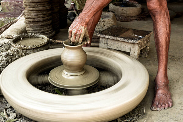 Handcrafted Pottery Creation on Traditional Spinning Wheel Close-Up