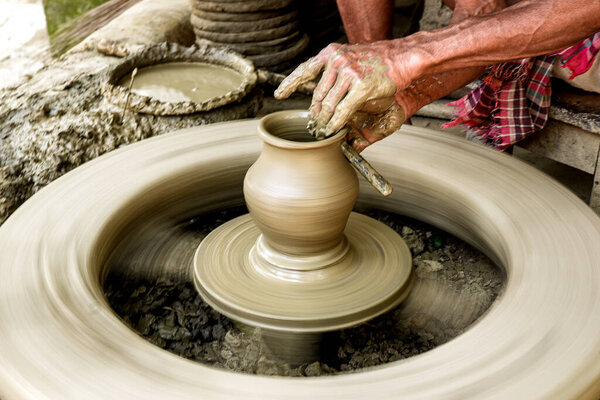 Handcrafted Pottery Creation on Traditional Spinning Wheel Close-Up