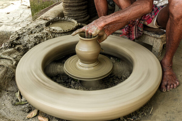 Handcrafted Pottery Creation on Traditional Spinning Wheel Close-Up