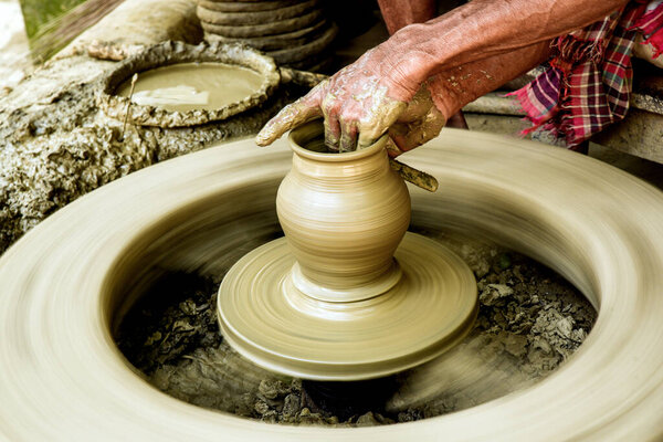 Handcrafted Pottery Creation on Traditional Spinning Wheel Close-Up