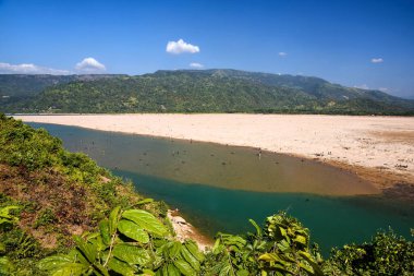 Panoramic View of a Tranquil River and Sandy Riverbed in a Mountain Valley