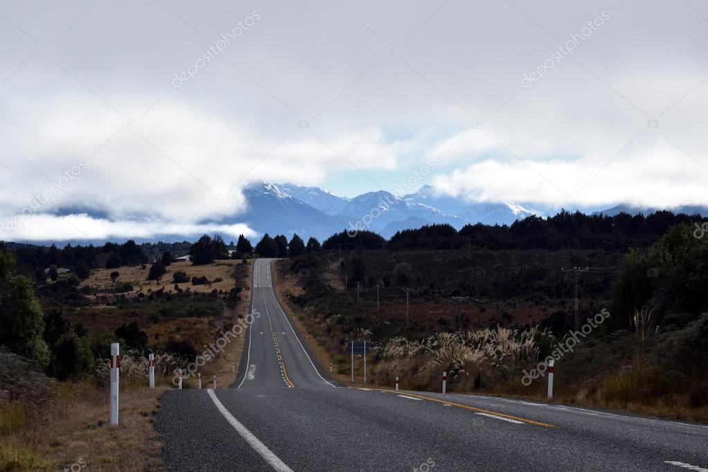 asphalt country road and mountains  