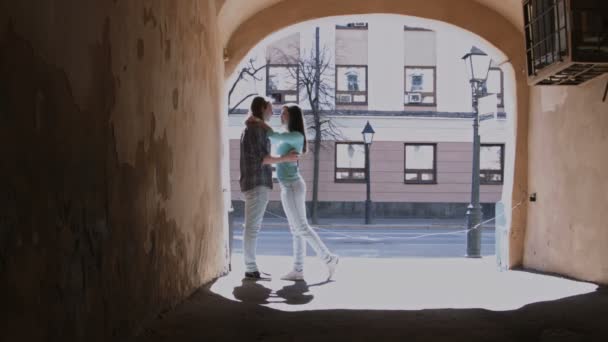 Cute girl and boy with long hair in dark glasses kissing in the alley, Russia, Kazan, 27.04.2016 — Stock Video