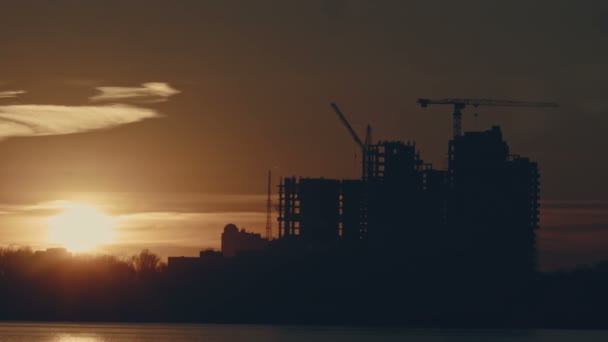 Time lapse of construction at sunset — Stock Video